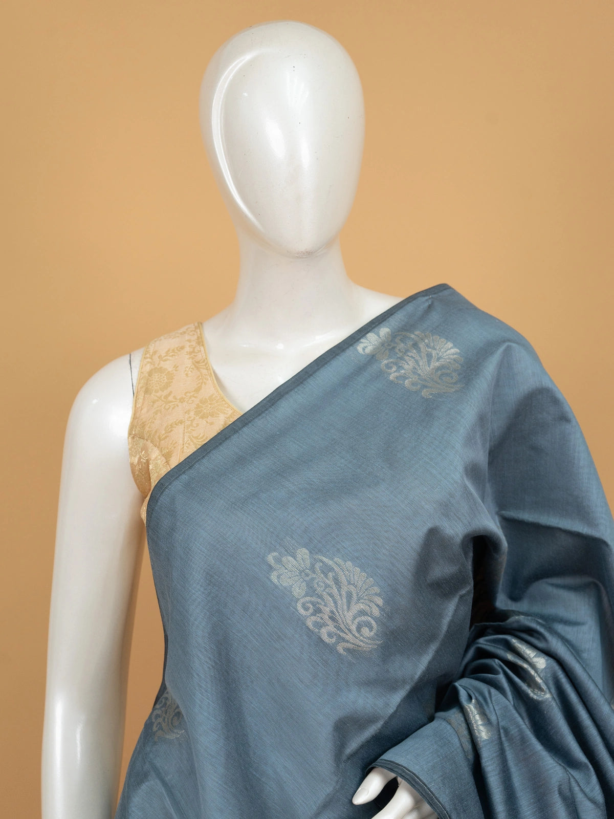 Grey silk cotton saree with mustard-orange contrast zari border and gold buttas