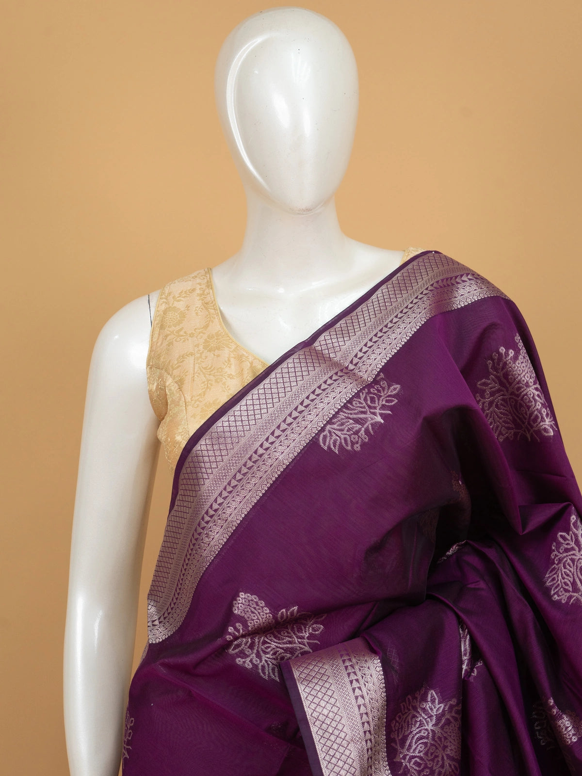Purple silk cotton saree with silver zari floral buttas and contrast green zari border and pallu