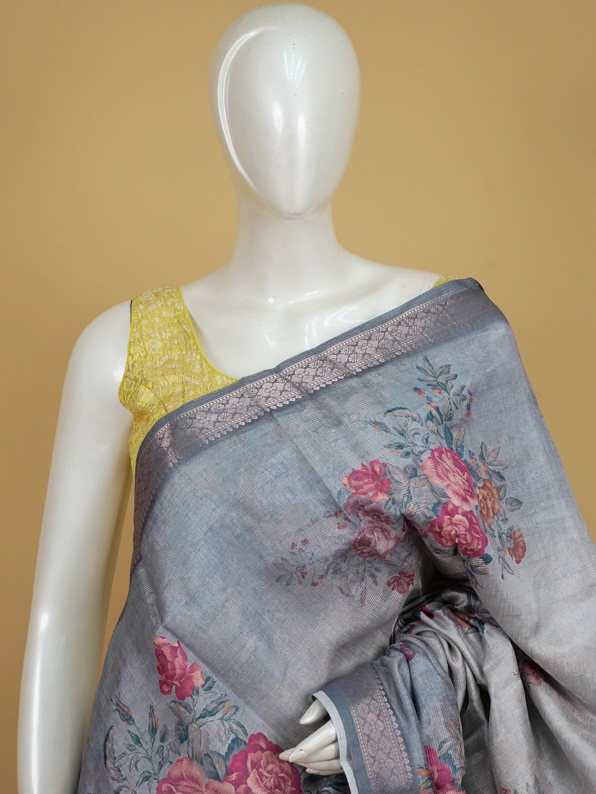 Grey semi tussar saree with pink floral prints and silver zari border