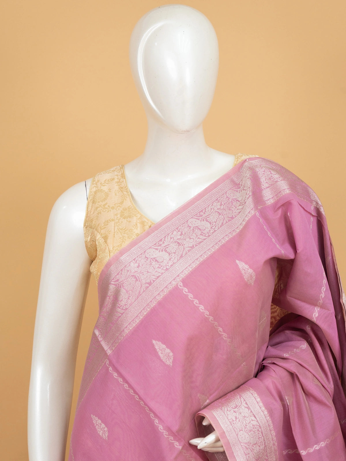 Pink silk cotton saree with silver zari buti motifs and ornate zari border