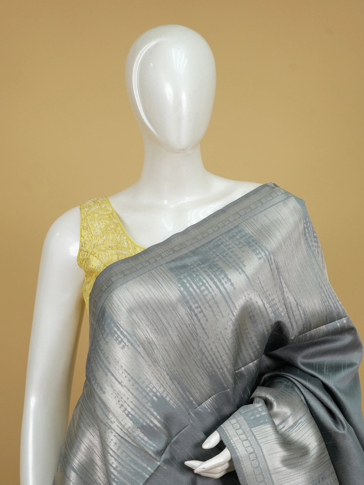Grey semi tussar saree with silver zari border and temple-motif pallu