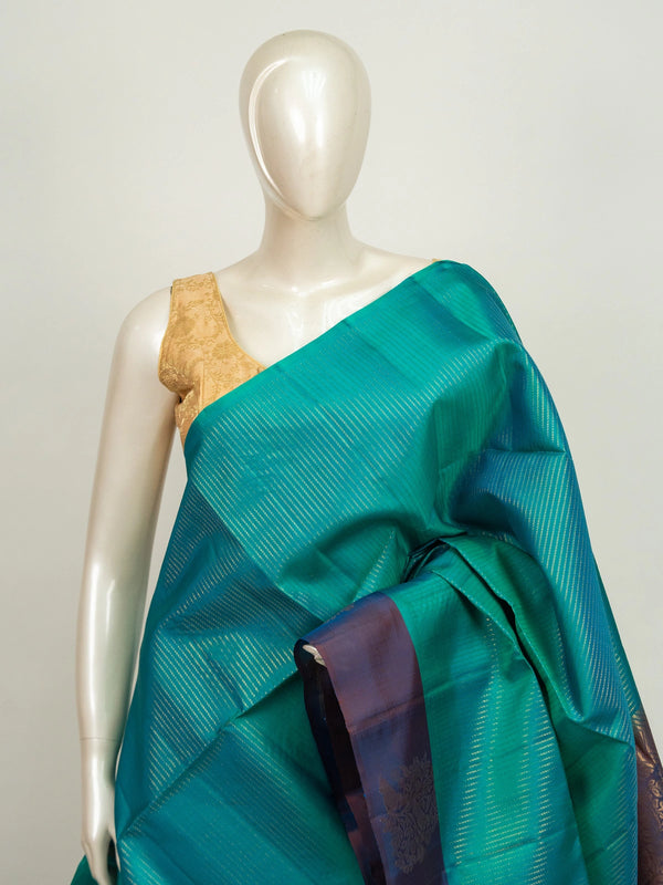 Teal green Kanchipuram Pure Mix saree with purple contrast border and gold zari brocade pallu