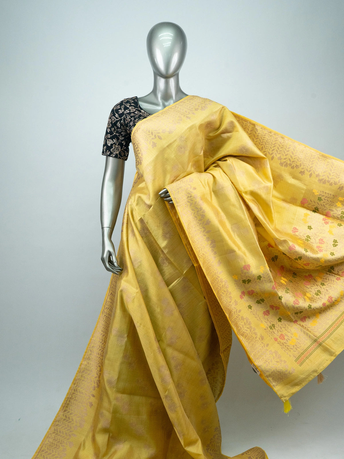 Yellow semi raw silk saree with zari leaf border and multicolour floral pallu