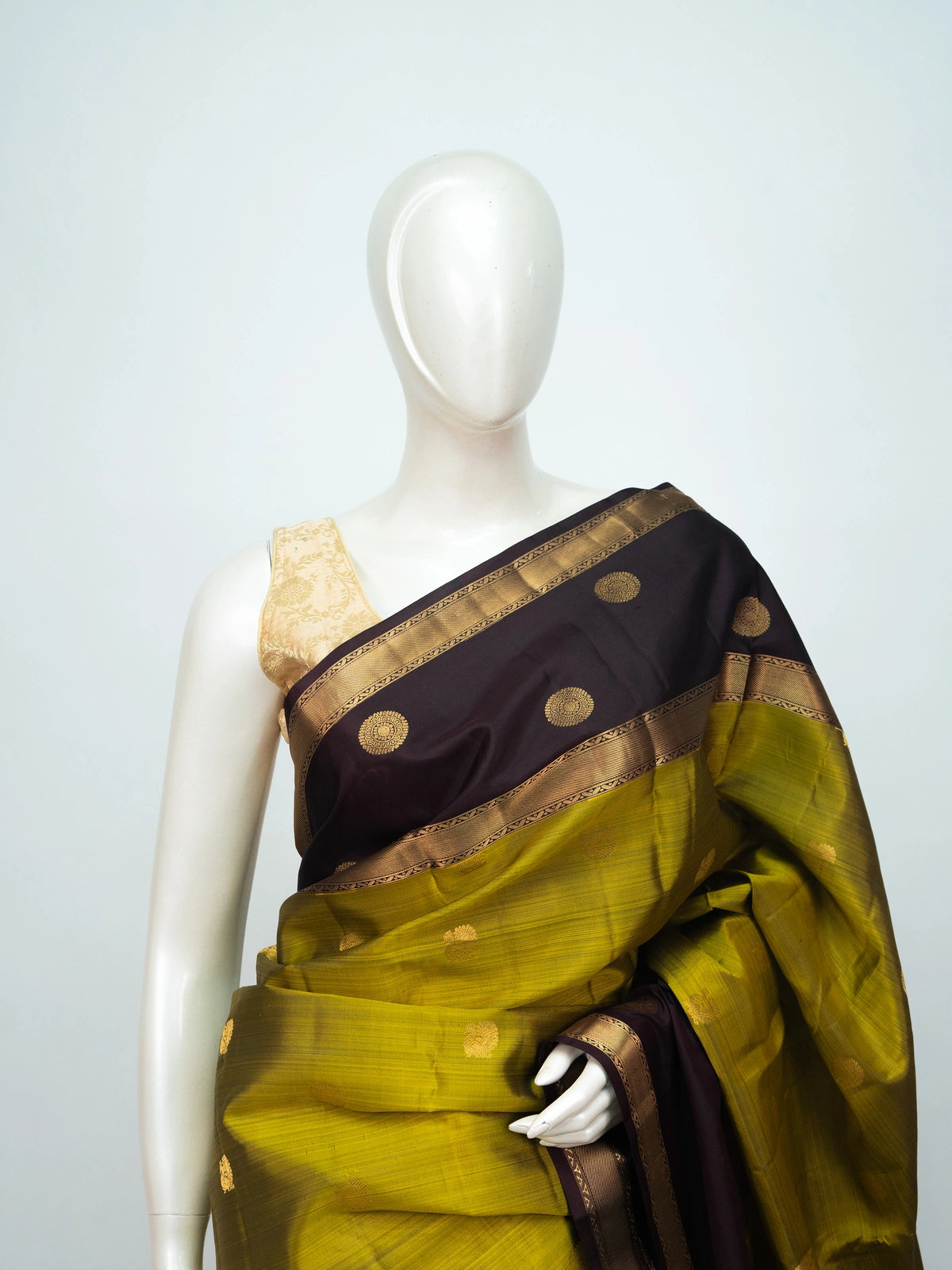 Mehndi green pure Kanchipuram silk saree with maroon contrast border and gold zari buttas