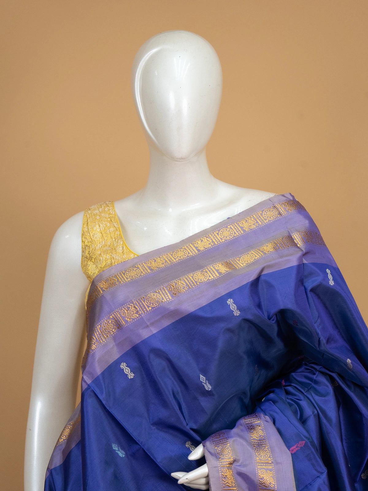 Royal blue banana silk saree with lavender-gold zari border and contrast beige striped pallu