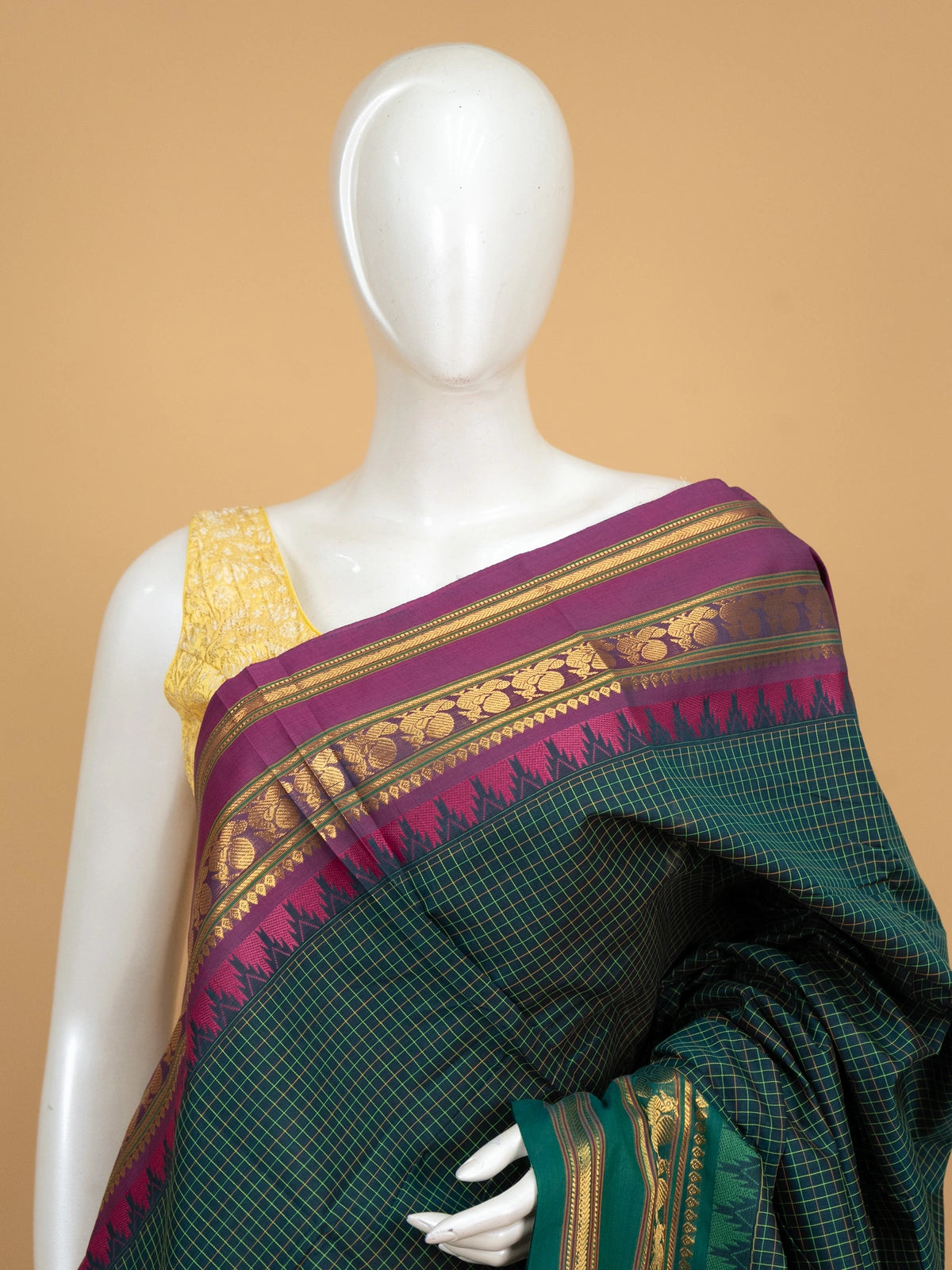 Dark green chequered Chettinad cotton saree with contrast magenta gold zari border and striped pallu
