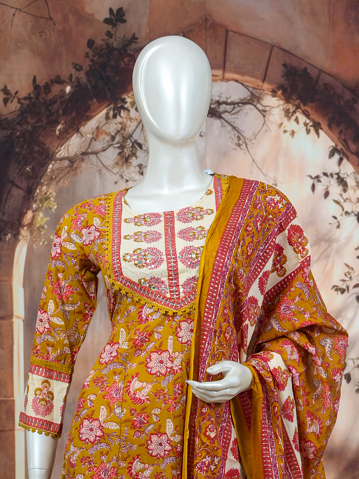 Mustard floral cotton Anarkali kurti set with mirror-work yoke, straight pants and matching printed dupatta