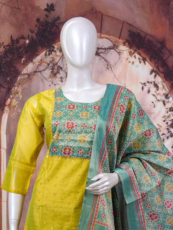 Yellow art silk kurti set with contrast teal printed yoke, teal straight pants and printed dupatta