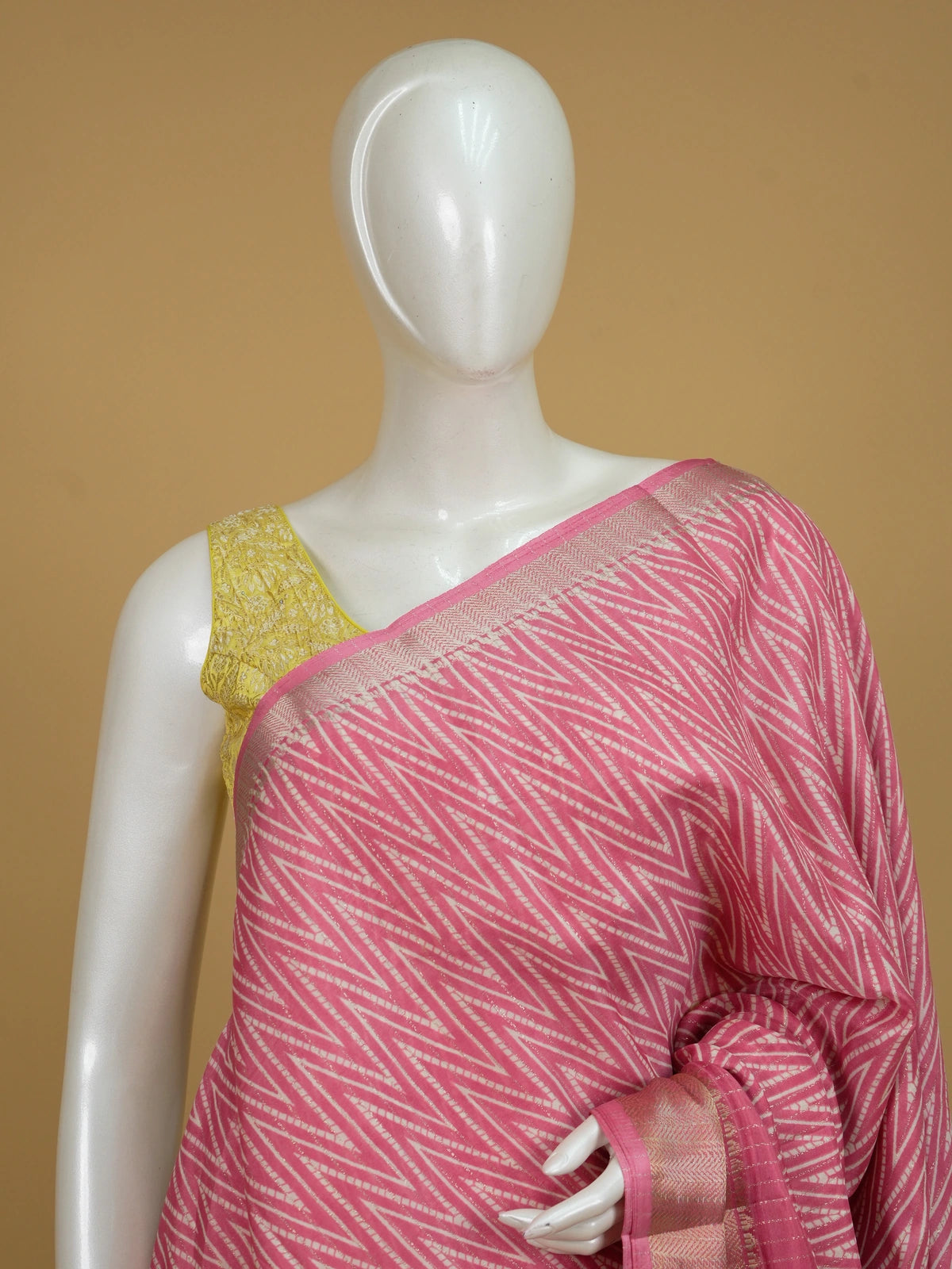 Pink and white chevron print designer saree with gold zari border and tree-motif pallu
