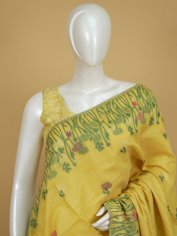 Yellow linen cotton saree with pink and purple floral motifs, floral meadow pallu and contrast green blouse