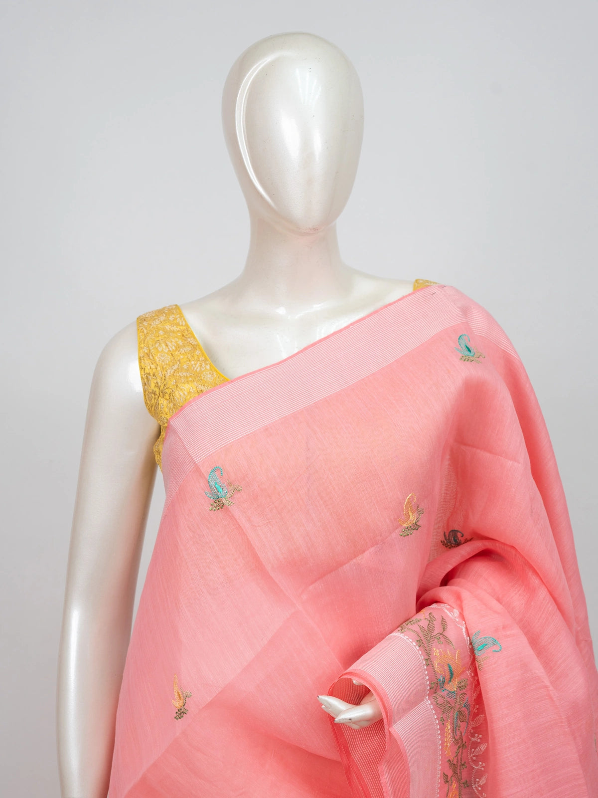 Pink linen cotton saree with embroidered paisley buttas, floral pallu and silver zari border