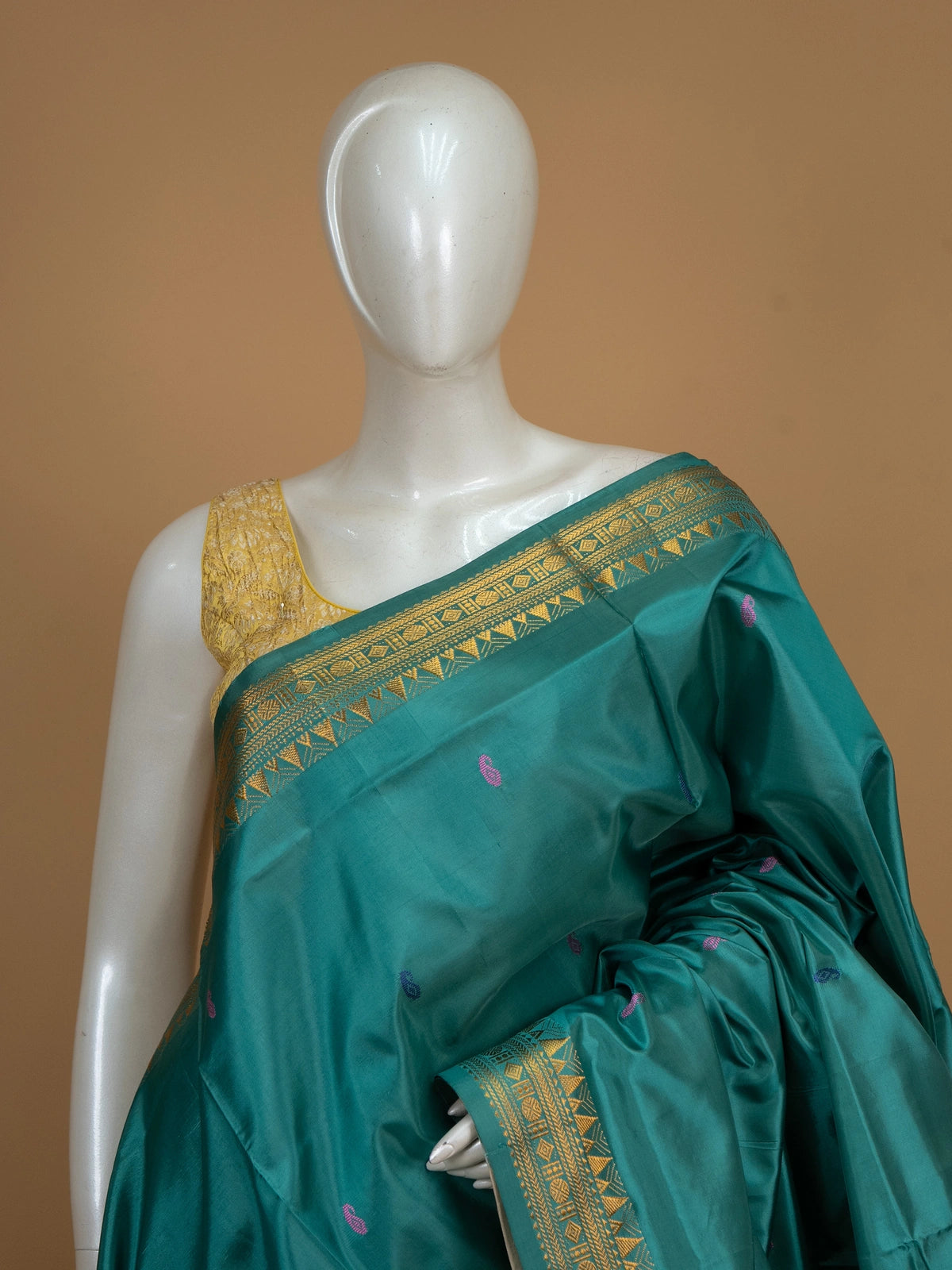 Teal green Banana Silk saree with gold zari border, paisley buttas and contrast cream pallu