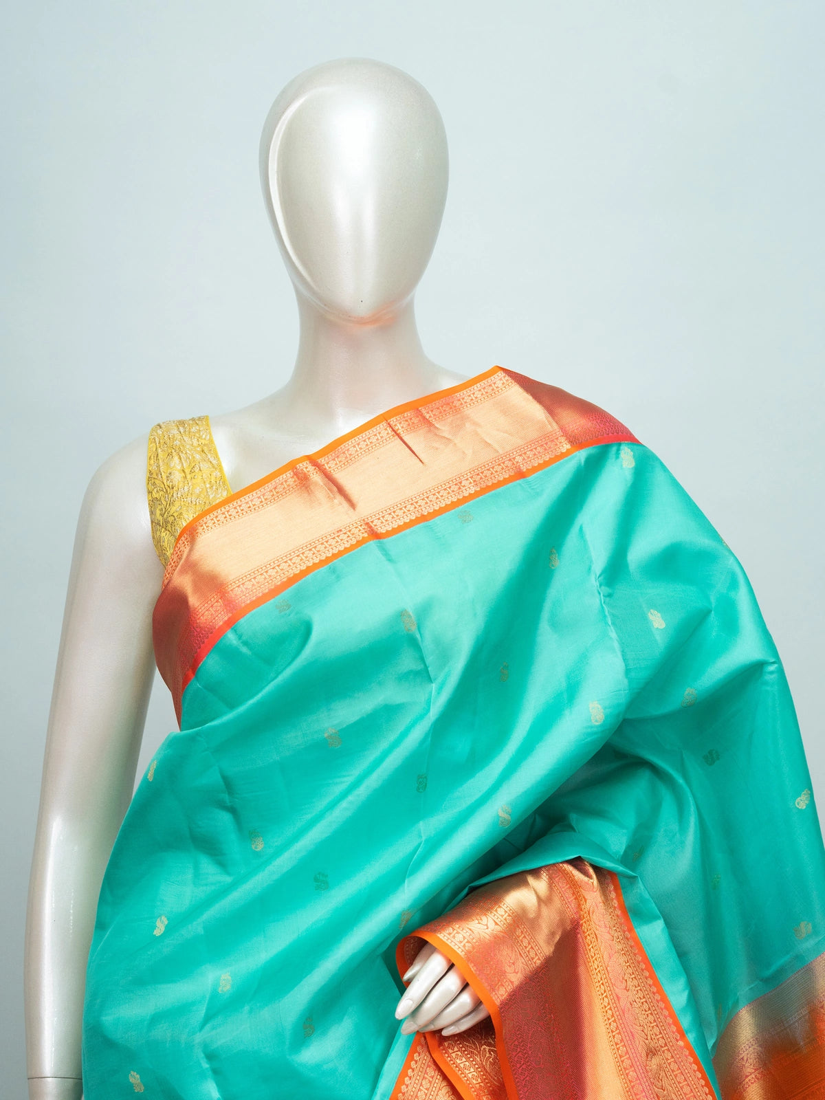 Teal pure Kanchipuram silk saree with contrast orange-red gold zari border and woven pallu