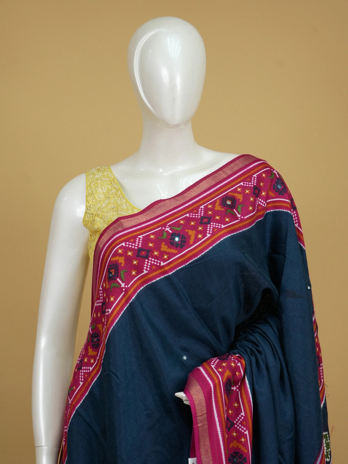 Navy blue linen cotton saree with contrast magenta Patola-style ikat border and pallu