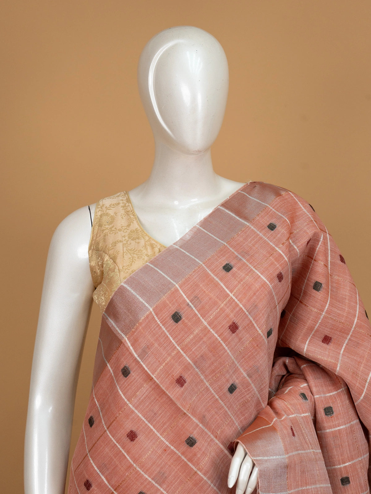 Peach and grey linen cotton saree with woven checks, buttis and contrast border