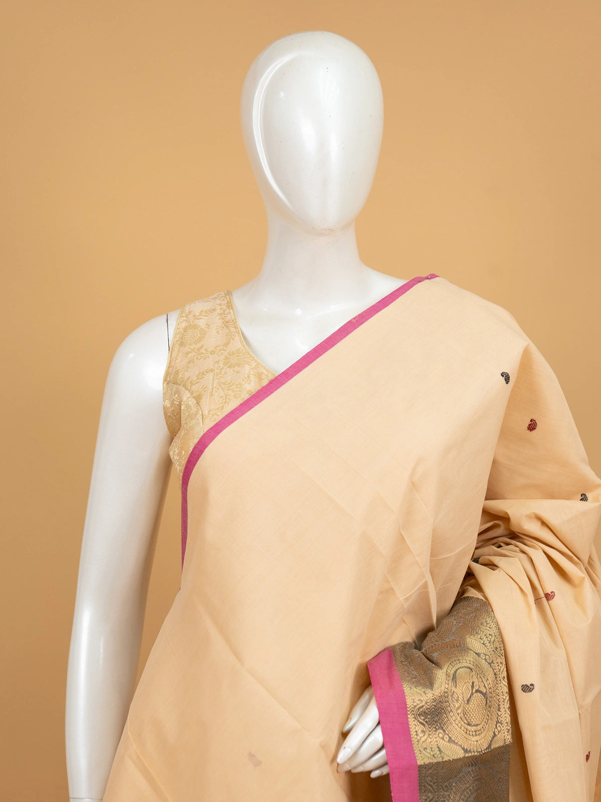 Cream Chettinad cotton saree with pink gold zari border and paisley buttis