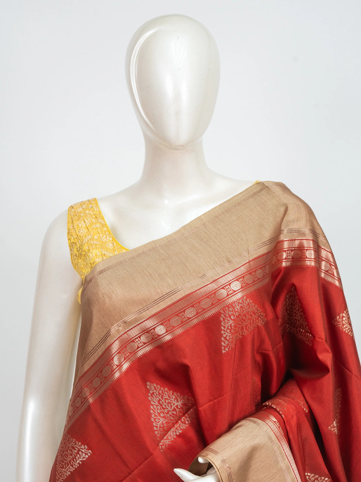 Red Kanchipuram Fancy Silk saree with contrast beige gold zari border and temple triangle motifs