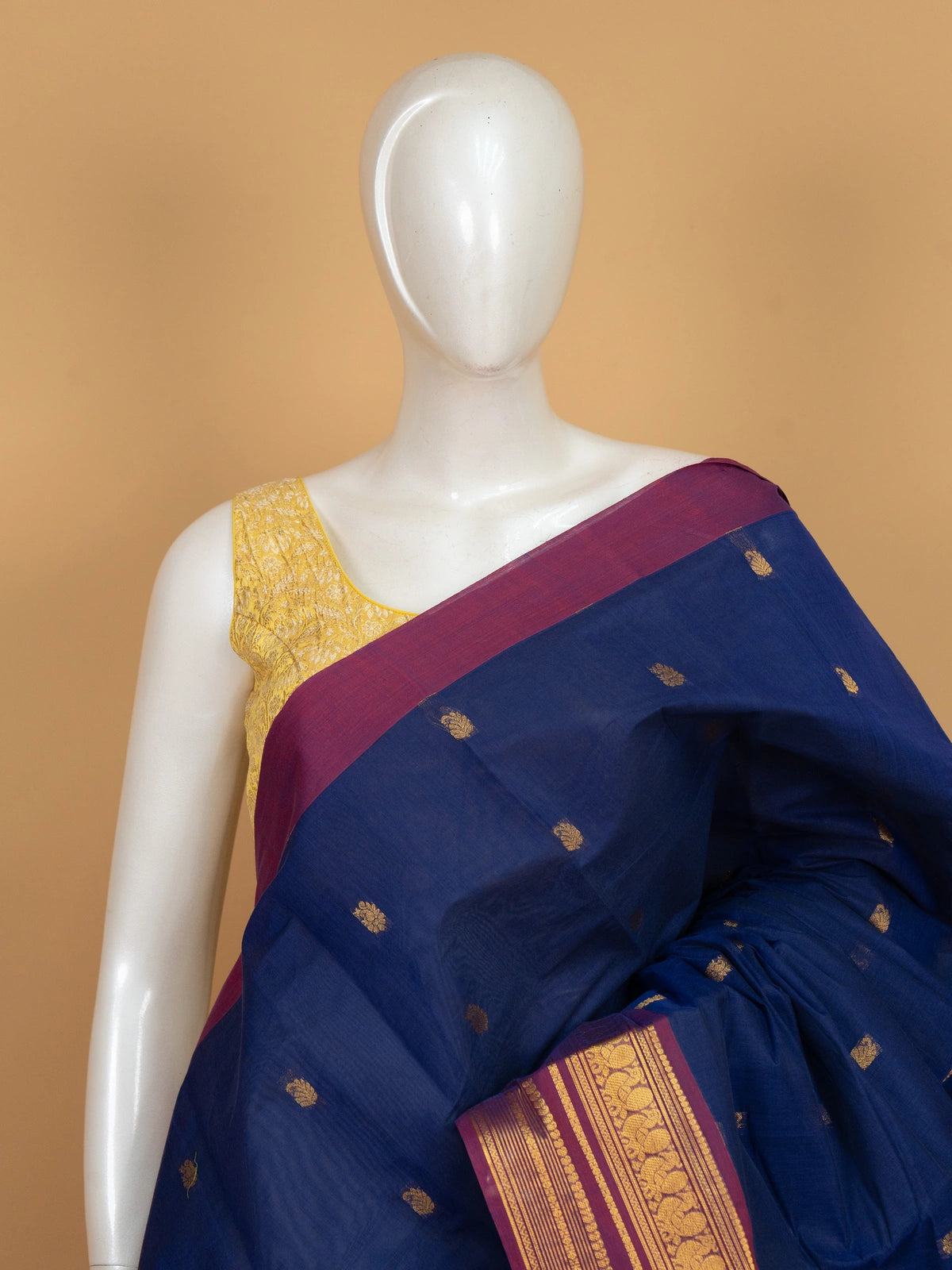 Navy blue Chettinad cotton saree with magenta gold zari border and yellow contrast blouse