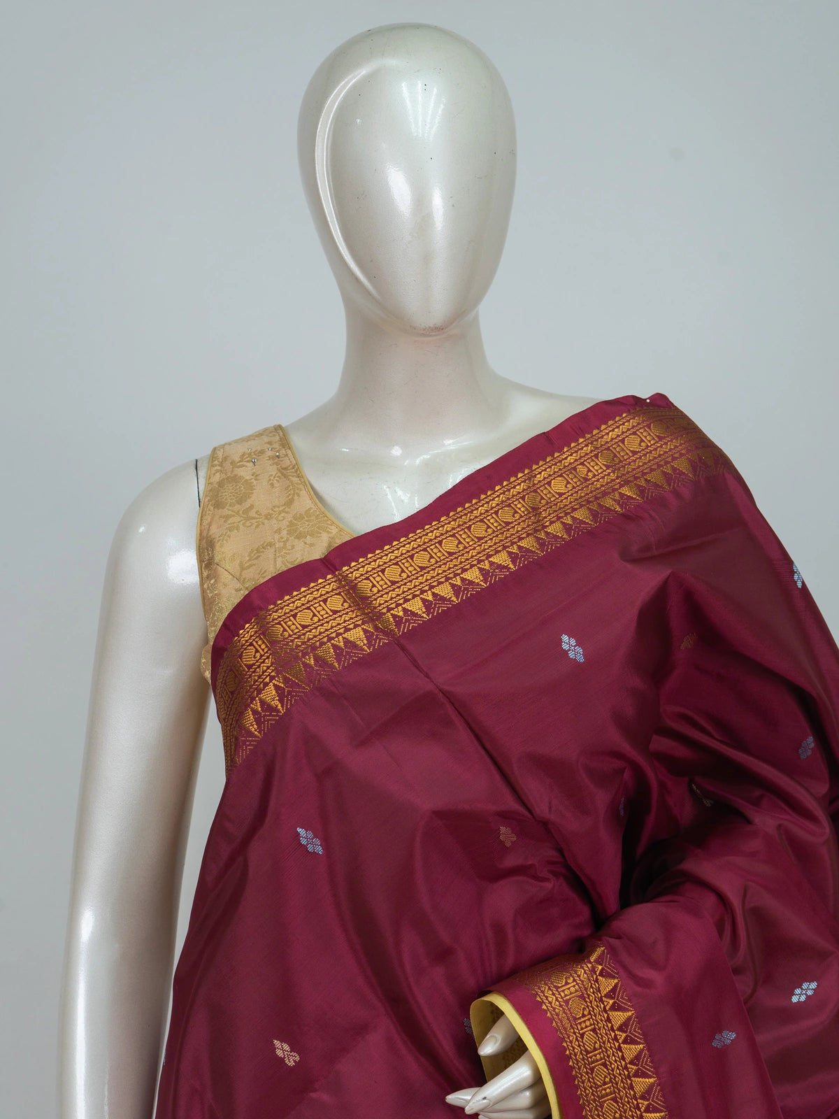 Maroon Banana silk saree with gold zari border, woven buta motifs and contrast cream pallu