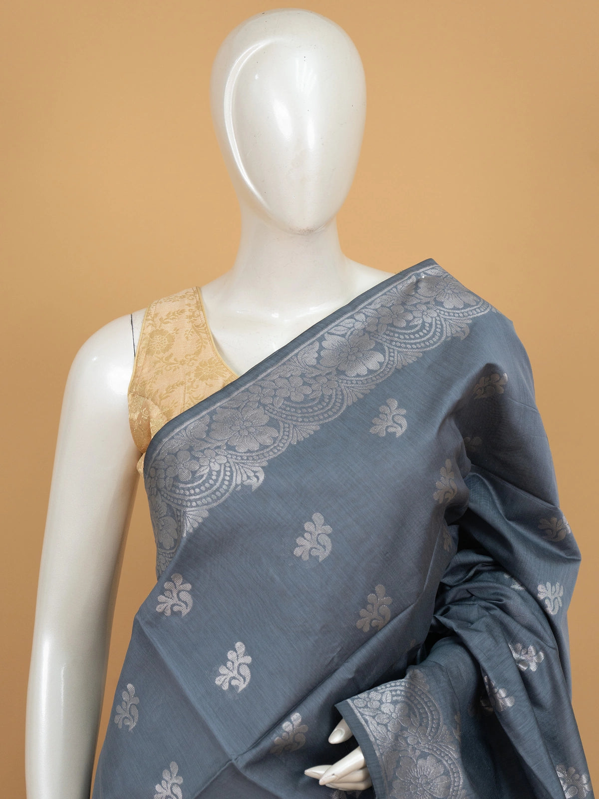 Grey silk cotton saree with silver zari floral buttas and ornate zari pallu