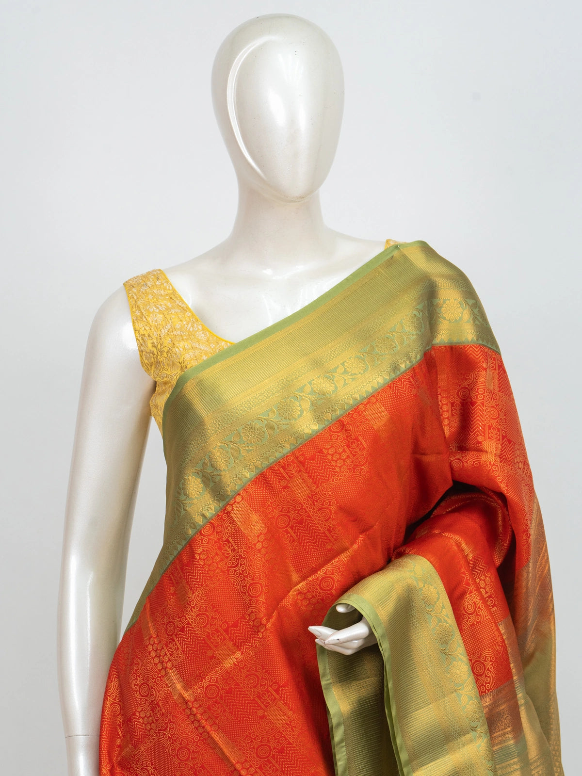 Orange Kanchipuram Fancy Silk saree with contrast green and gold zari border and pallu