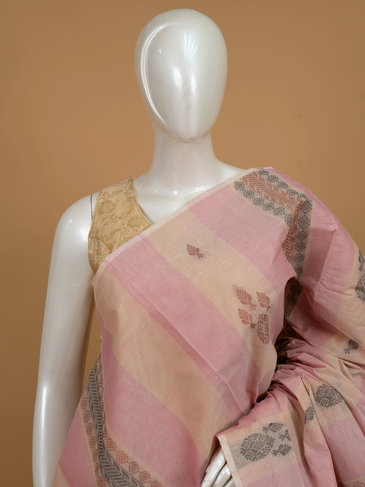 Pink and beige silk cotton saree with striped body, floral buttas and contrast geometric woven border