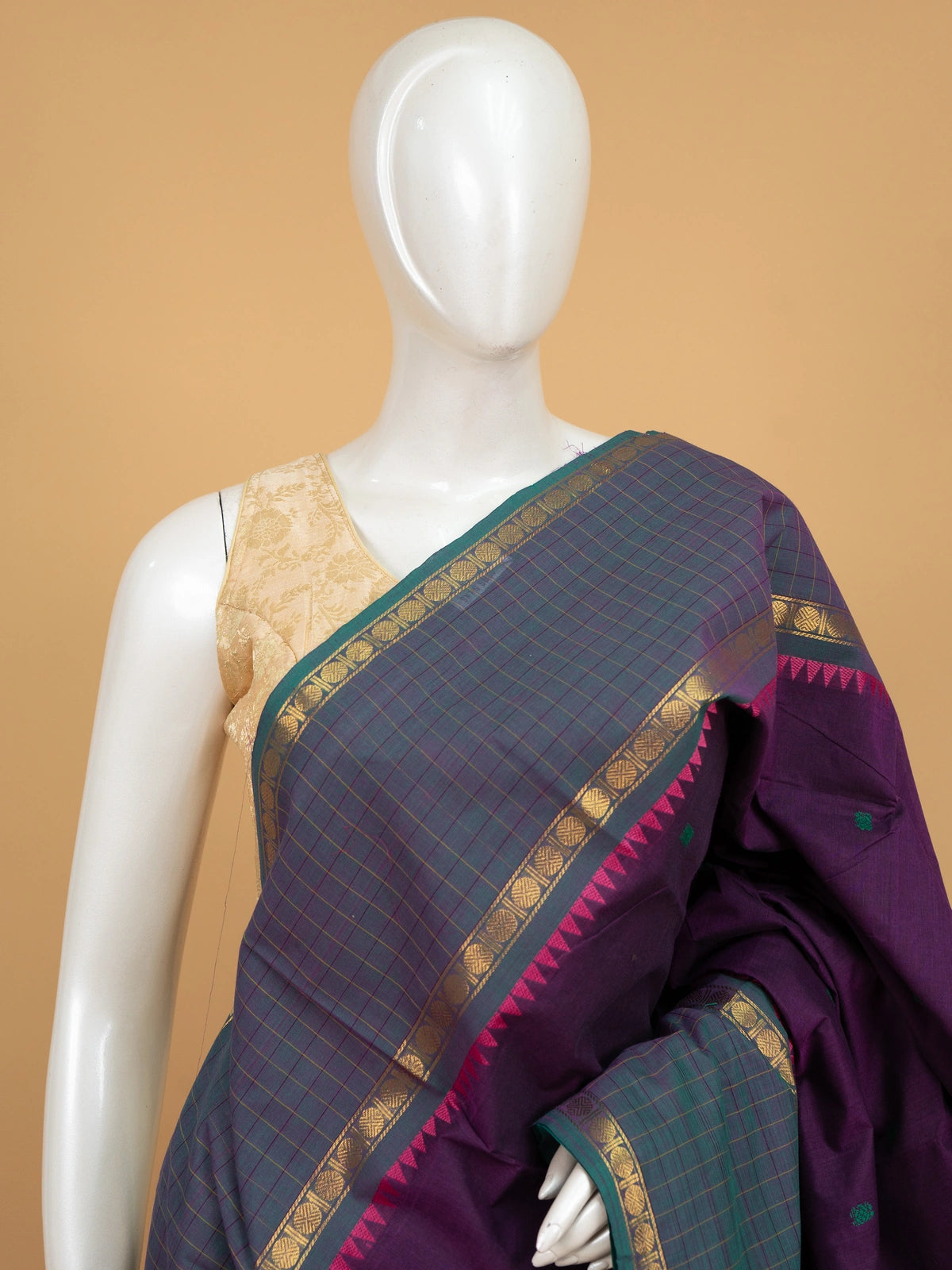 Purple Chettinad cotton saree with teal-green gold zari contrast border, temple motifs and green butta