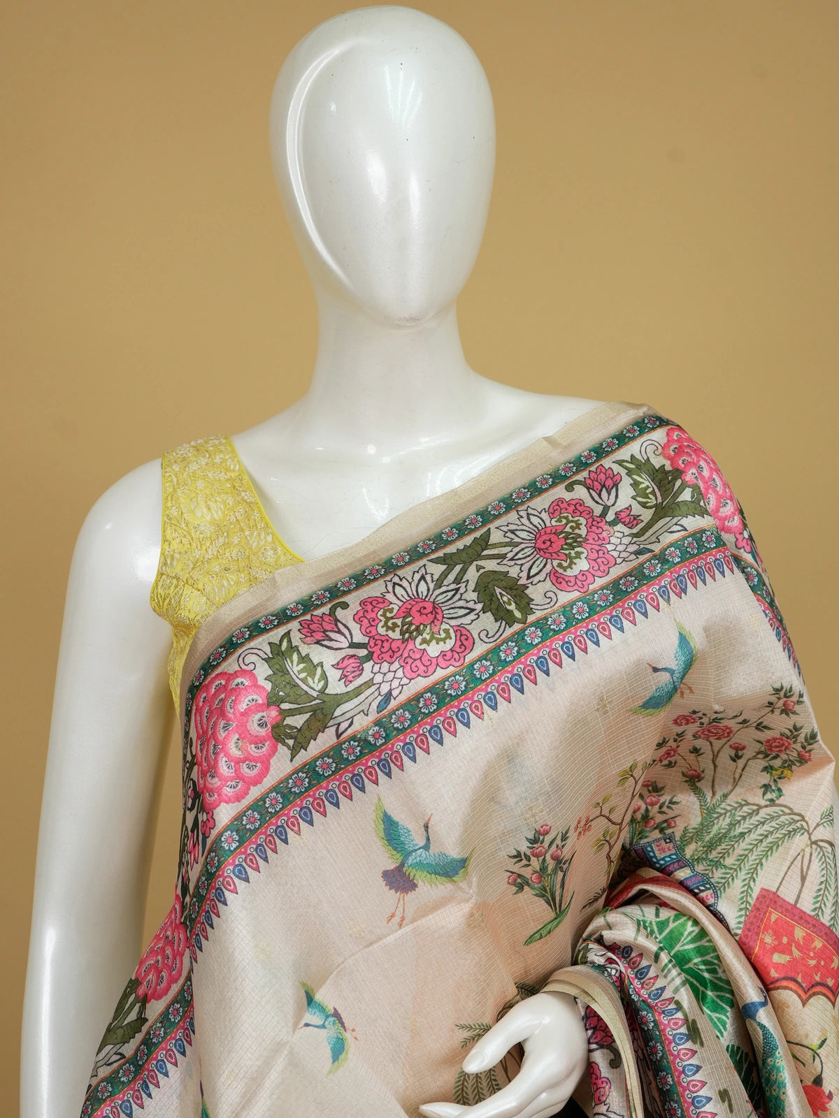 Cream semi tussar saree with pink floral Mughal garden print, peacock and lotus motifs and gold zari border