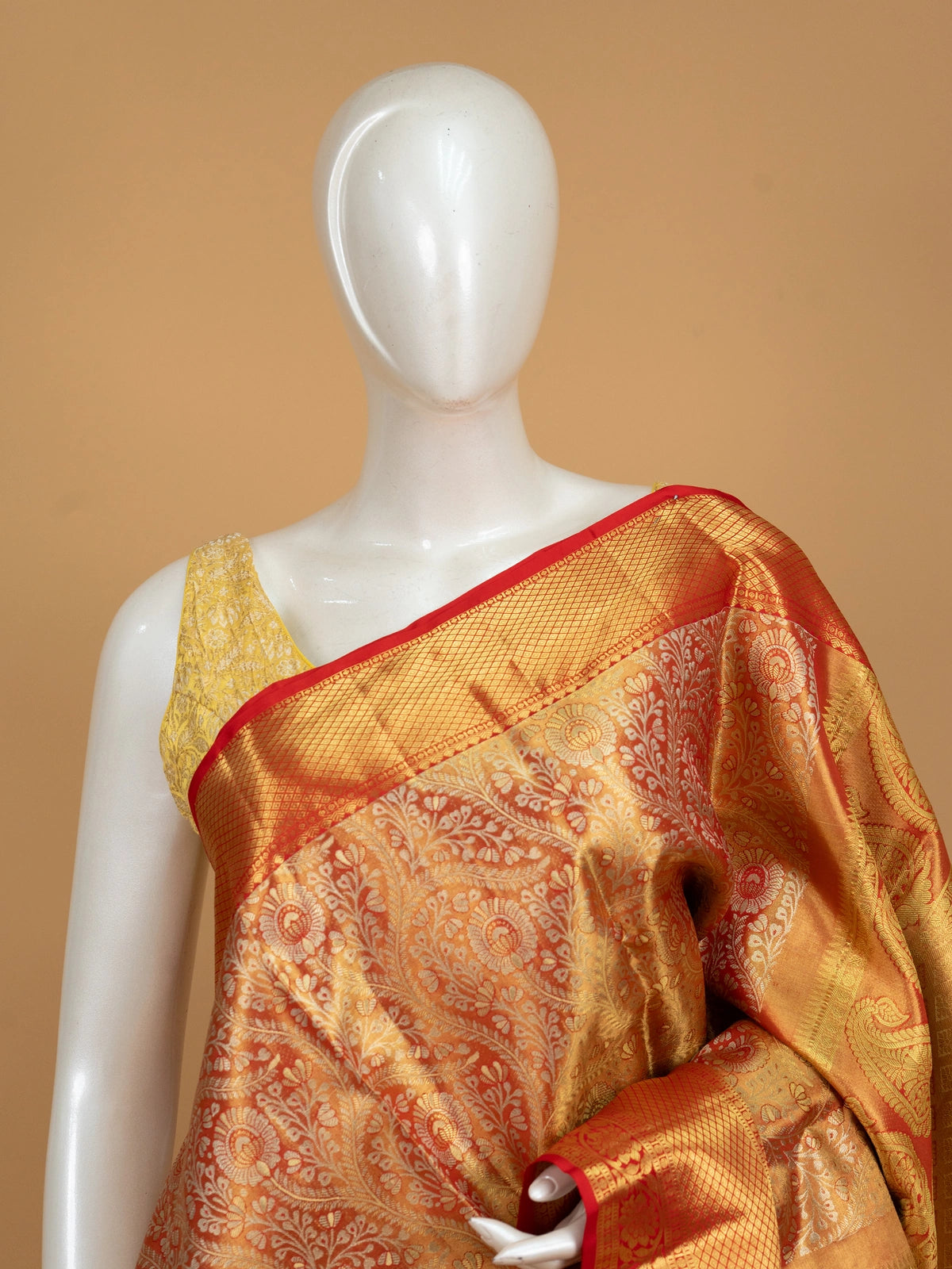 Orange-gold pure Kanchipuram silk saree with gold zari floral jaal body and contrast red zari border