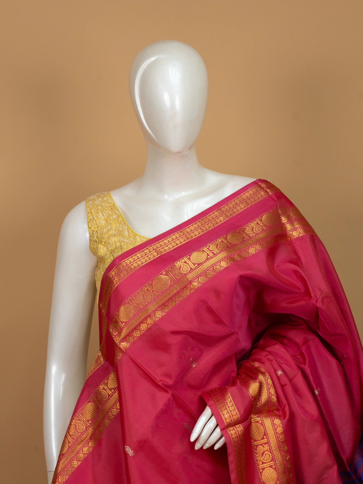 Pink banana silk saree with royal blue contrast pallu and gold zari peacock border