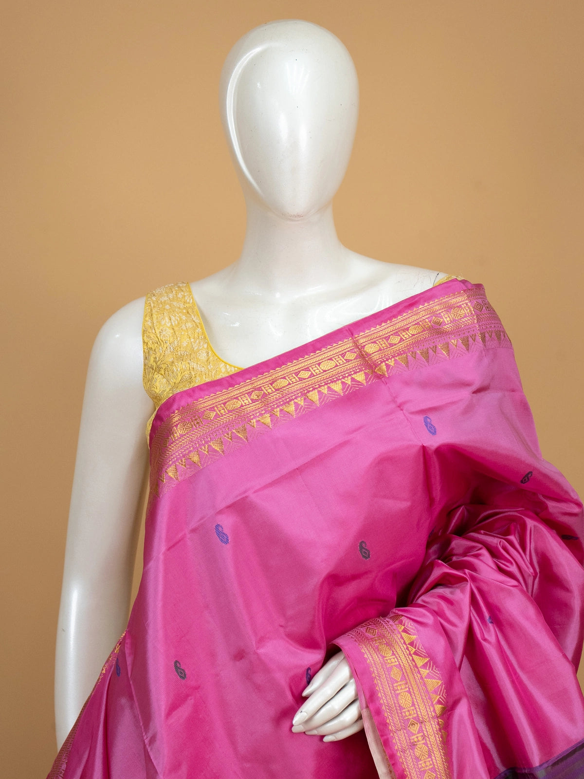 Pink Banana Silk saree with blue paisley butta, gold zari border and contrast cream striped pallu