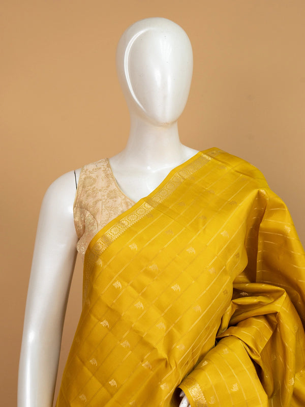 Mustard yellow pure Kanchipuram silk saree with gold zari buttas and border