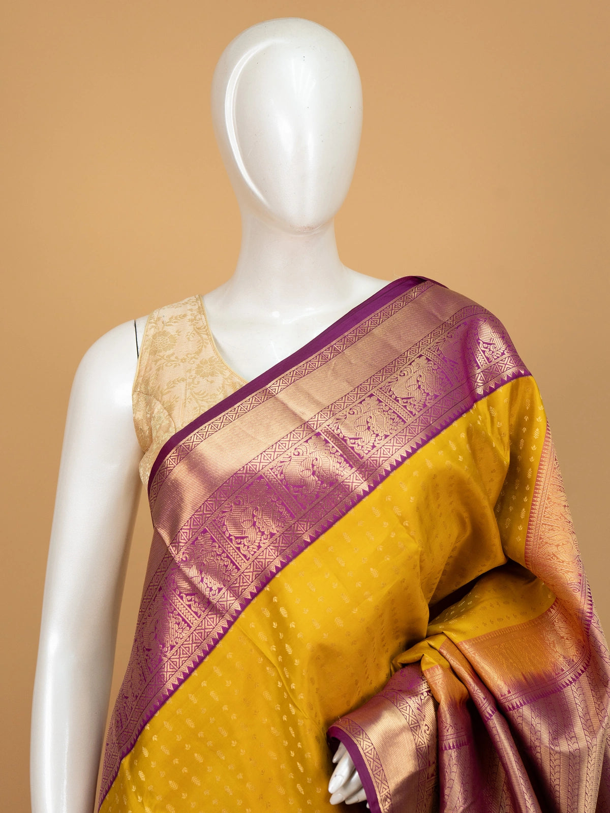 Mustard yellow pure Kanchipuram silk saree with magenta contrast gold zari border and pallu