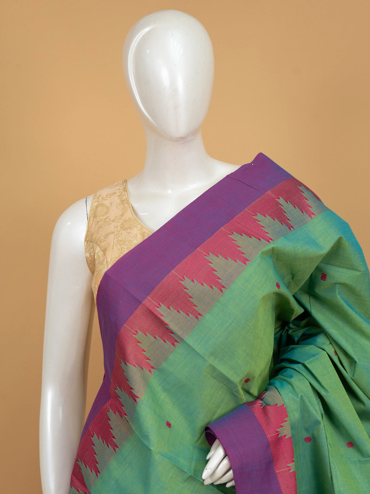 Green Chettinad cotton saree with pink and purple temple border and woven buttas