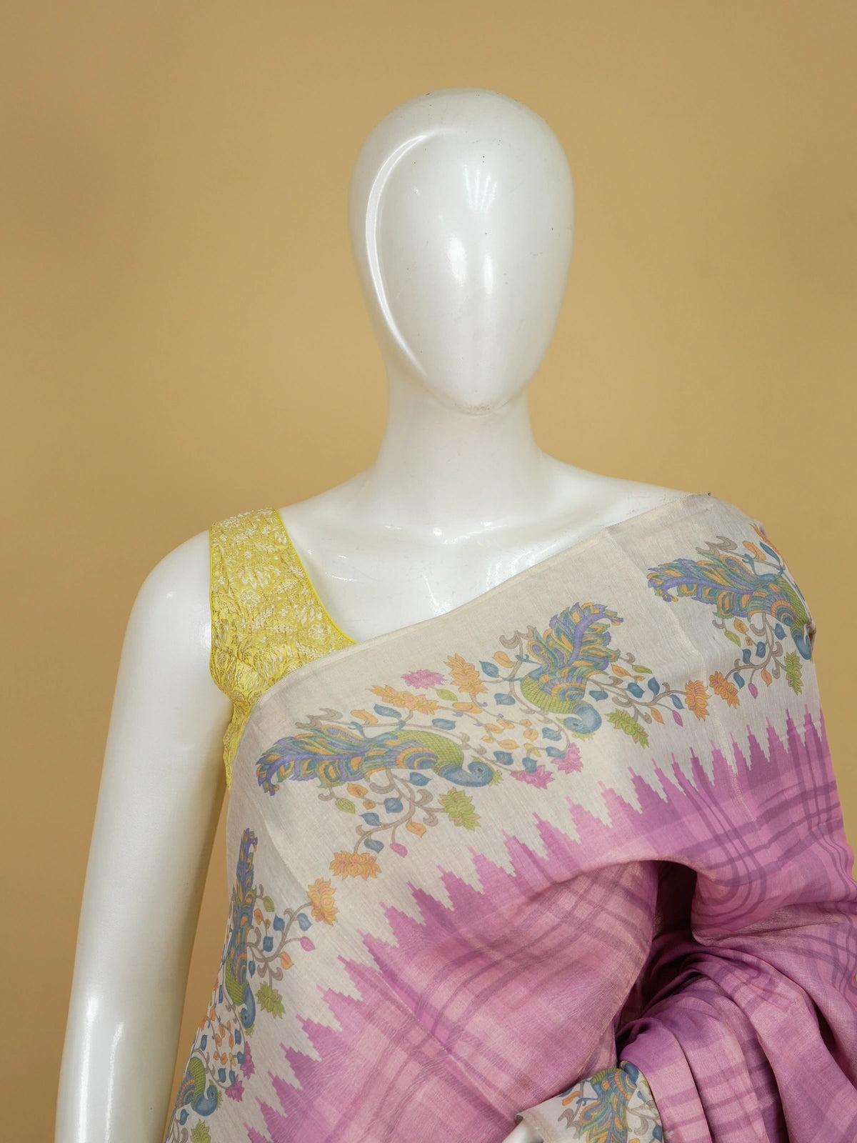 Pink and cream linen cotton saree with checked body, temple border and Kalamkari peacock pallu