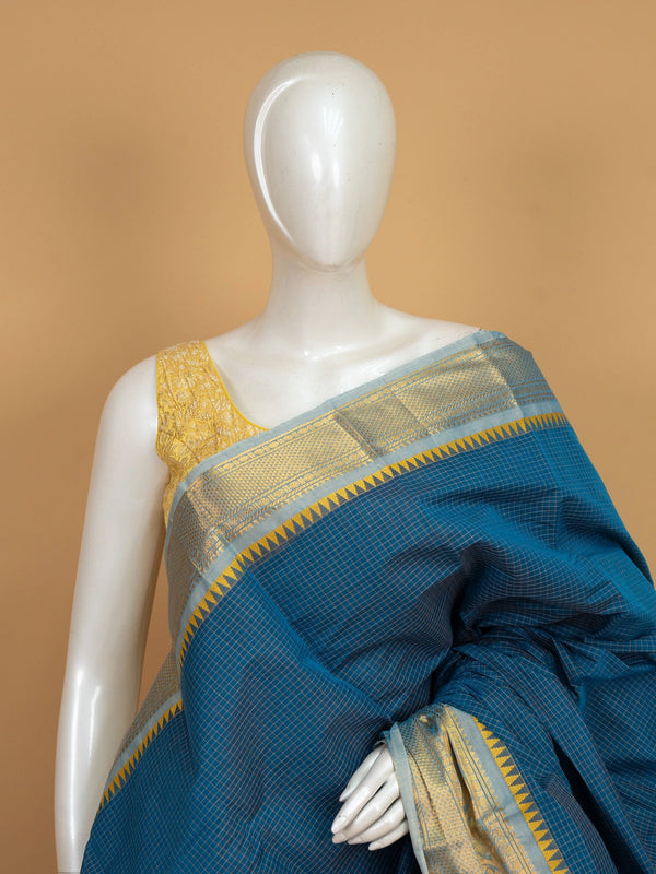 Teal blue Chettinad cotton saree with gold zari temple border, woven checks, and contrast yellow blouse