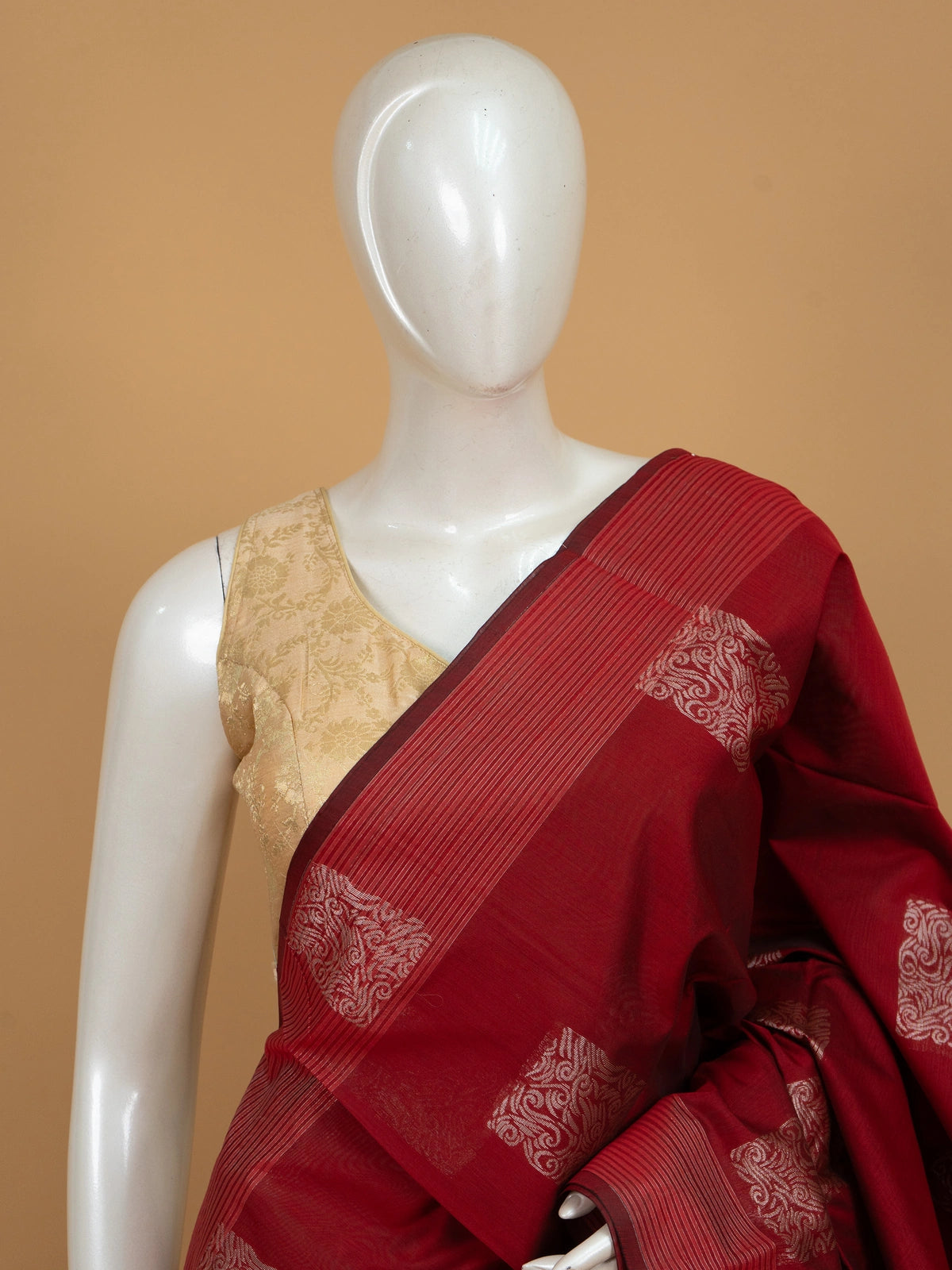 Maroon silk cotton saree with silver zari square buttas and woven pallu