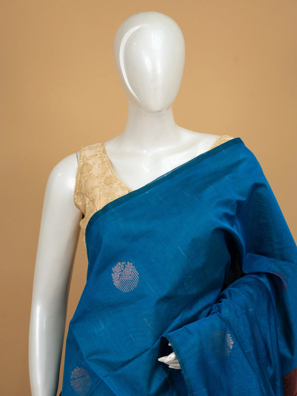 Peacock blue silk cotton saree with maroon contrast zari border and woven butta motifs
