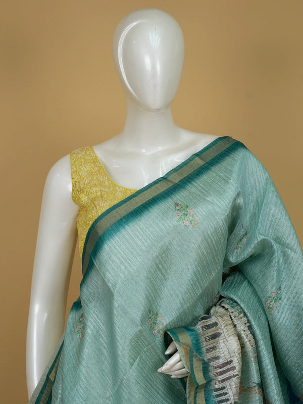 Sea green semi tussar saree with teal zari border and peacock palace printed pallu