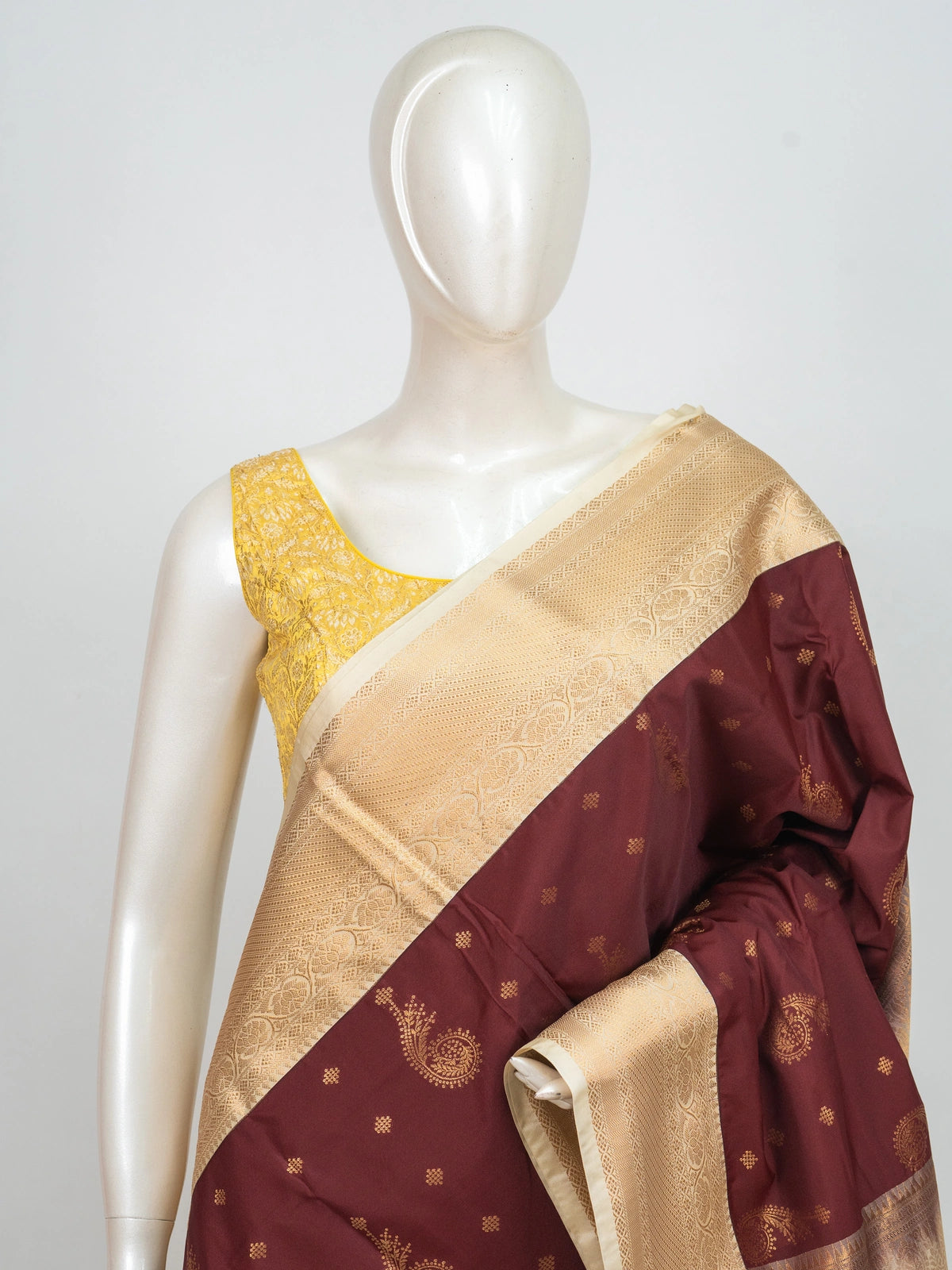 Maroon and cream semi silk saree with gold zari paisley motifs and contrast cream floral zari border