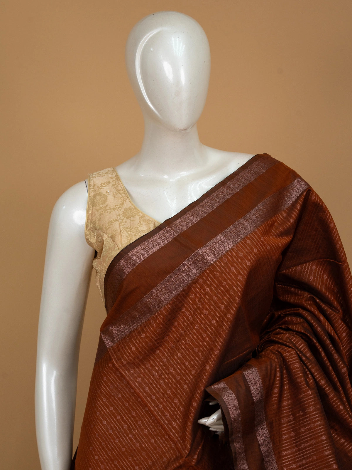 Rust brown silk cotton saree with contrast maroon zari border and woven pallu