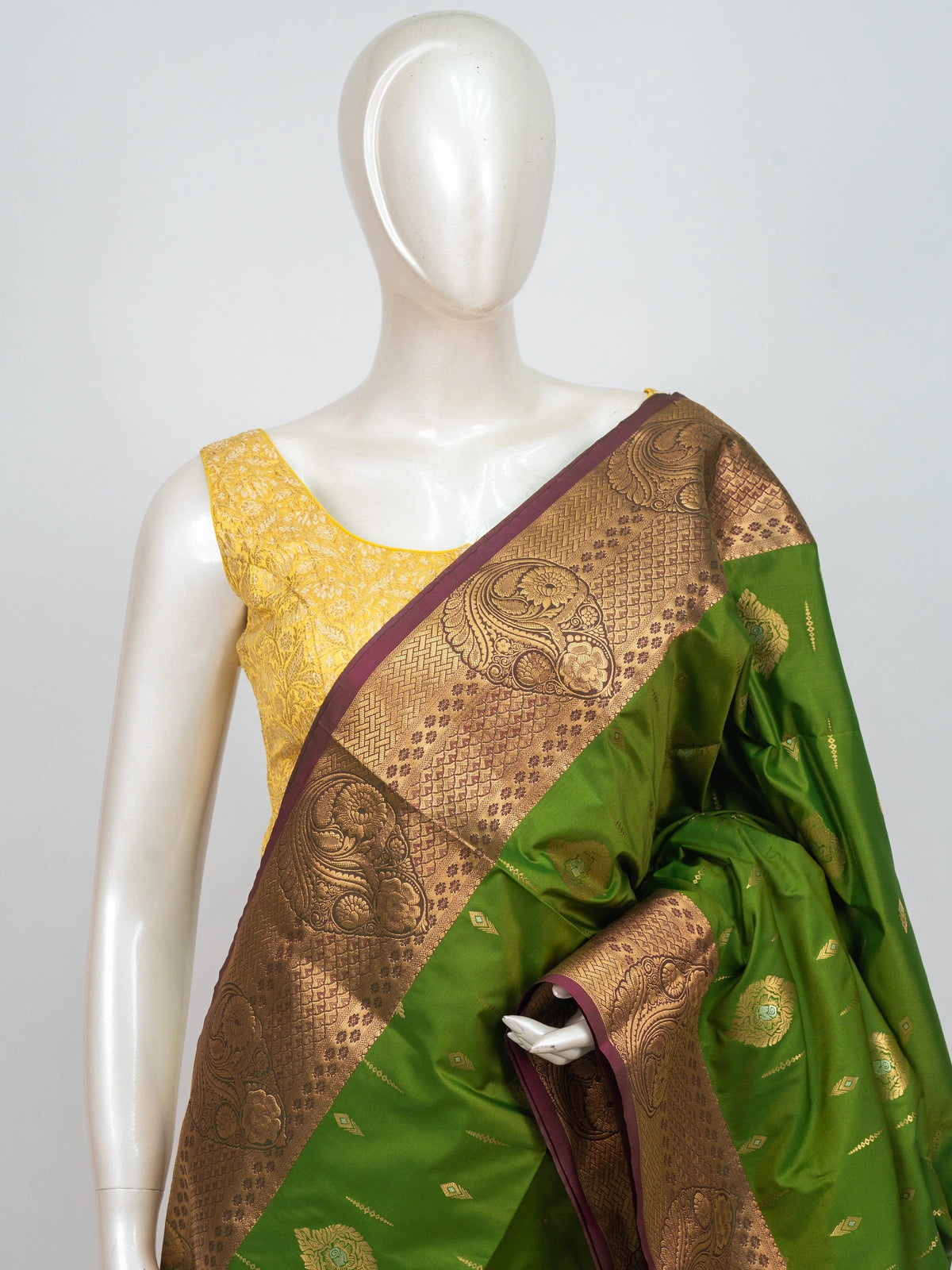 Parrot green semi silk saree with contrast pink gold zari border and floral pallu