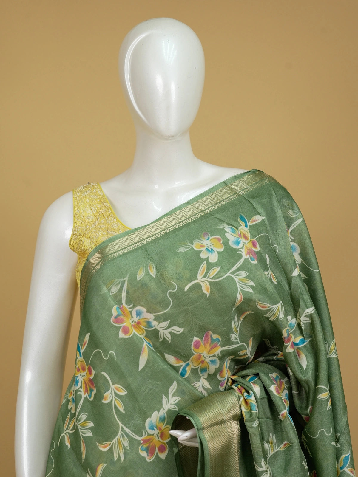 Green floral printed designer saree with gold zari border and decorative pallu