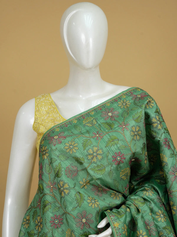 Green semi tussar saree with multicolour floral thread embroidery and gold zari accents