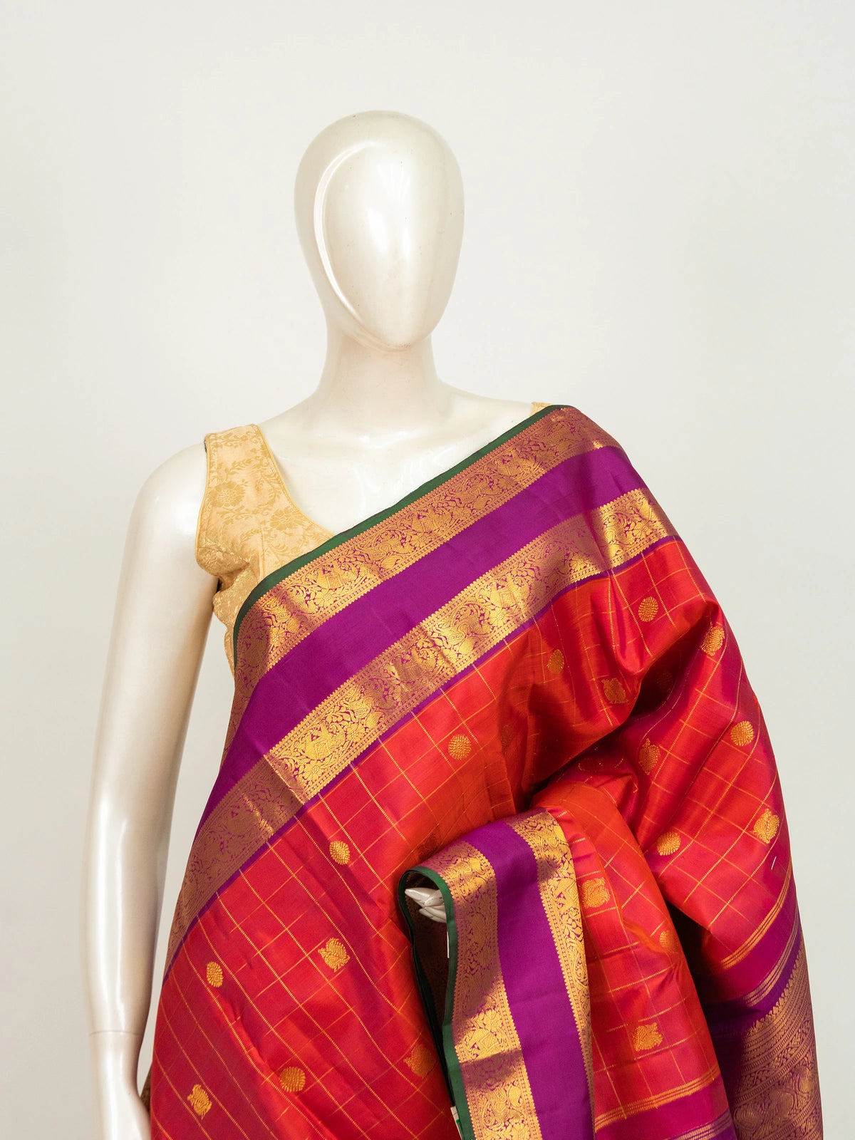 Orange pure Kanchipuram silk saree with magenta contrast gold zari border and brocade pallu