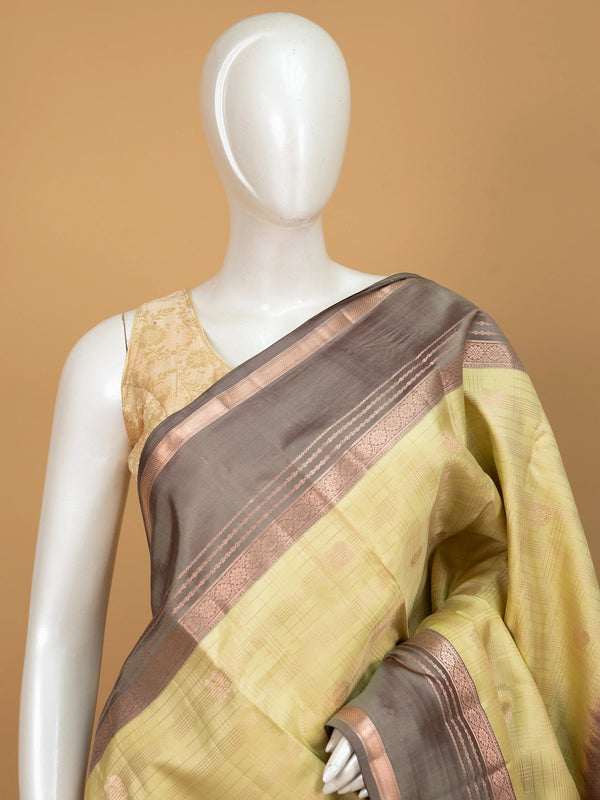 Mehendi green pure Kanchipuram silk saree with grey-brown contrast border and copper zari pallu