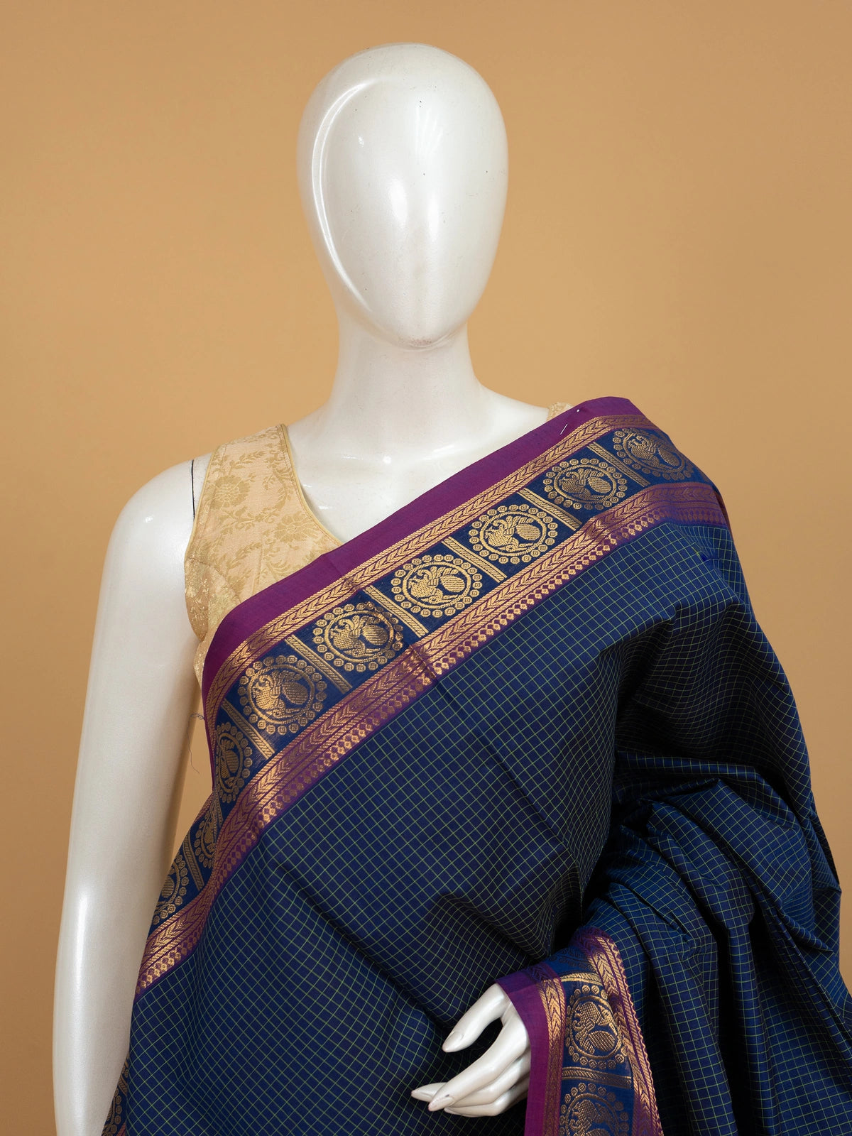Navy blue Chettinad cotton saree with green checks and magenta gold zari peacock border