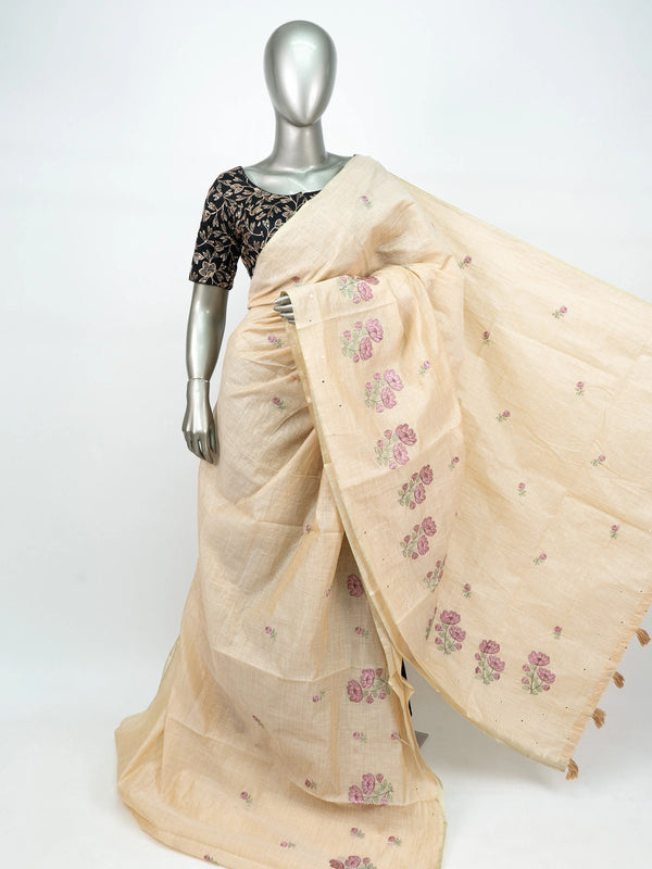 Cream linen cotton saree with mauve floral embroidery, fine zari border and tasseled pallu