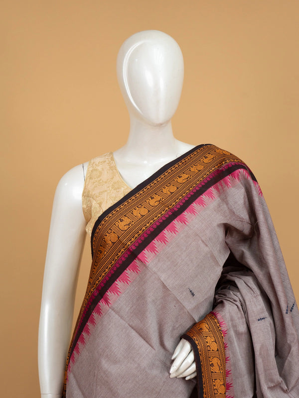 Grey Chettinad cotton saree with mustard and black contrast border, pink temple edging and woven animal motifs