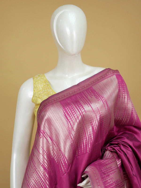 Magenta pink semi tussar saree with silver zari ikat streaks and temple-design pallu